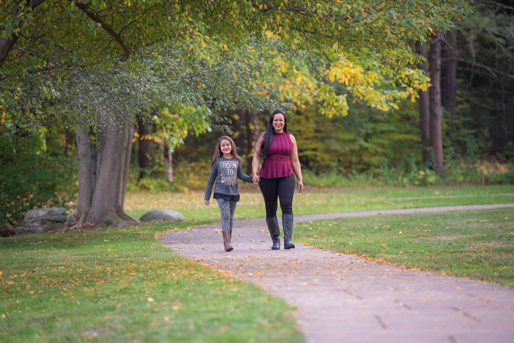 mother and daughter walking on the park