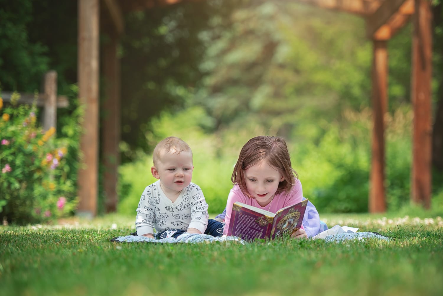 Children reading book at Acton Arboretum