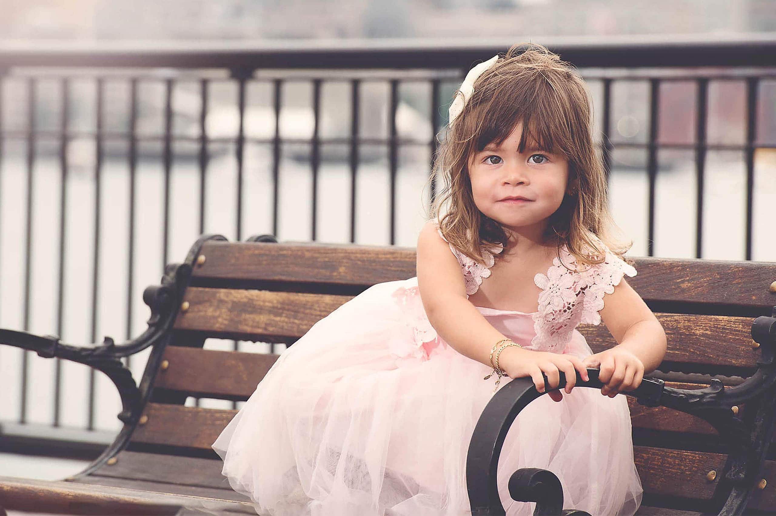 Little girl on a bench in Boston