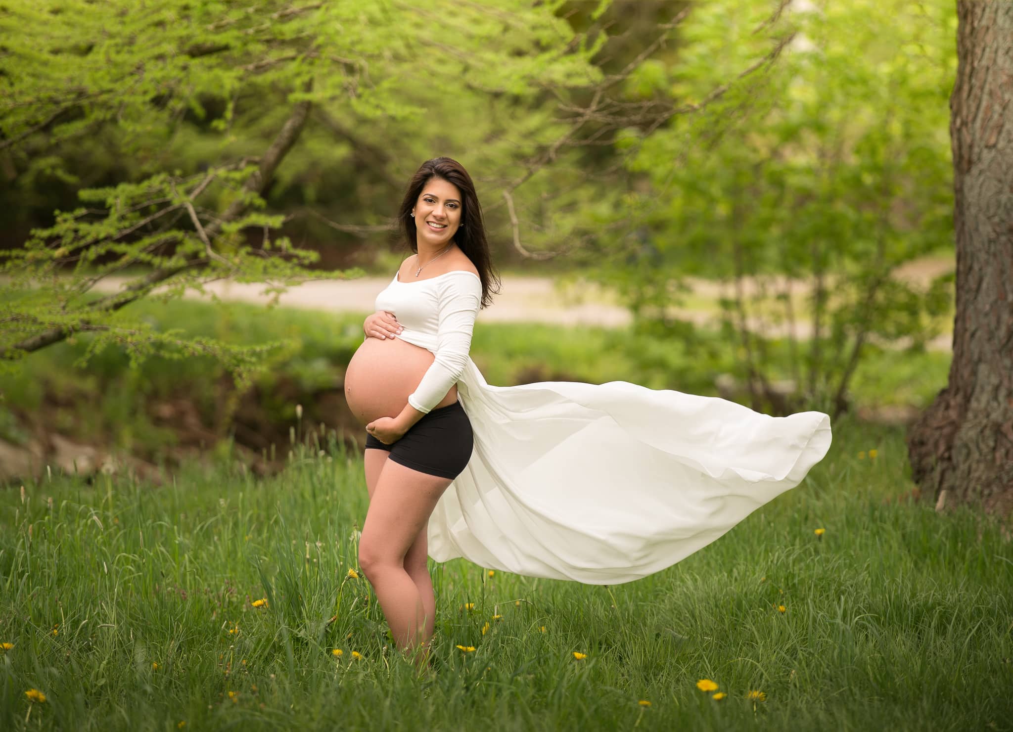 Young future mother hung pregnant belly