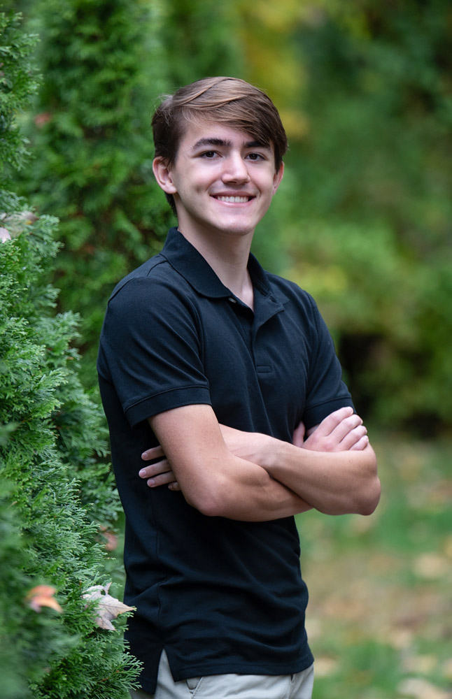 High school senior boy portrait by a park in Massachusetts.