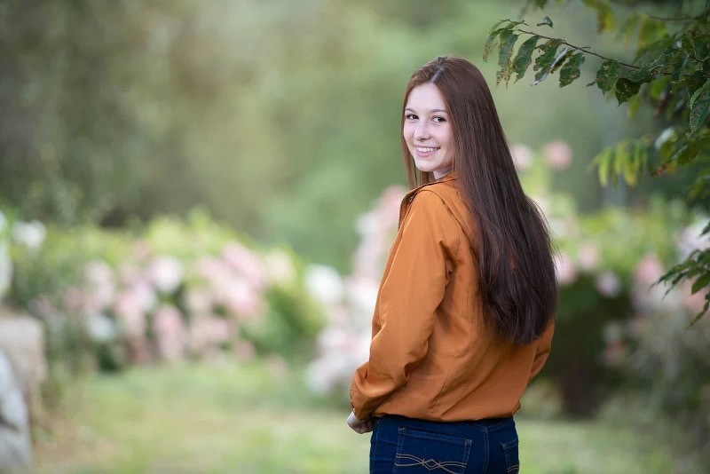 senior pictures outdoor garden looking over the shoulder near Westford, ma