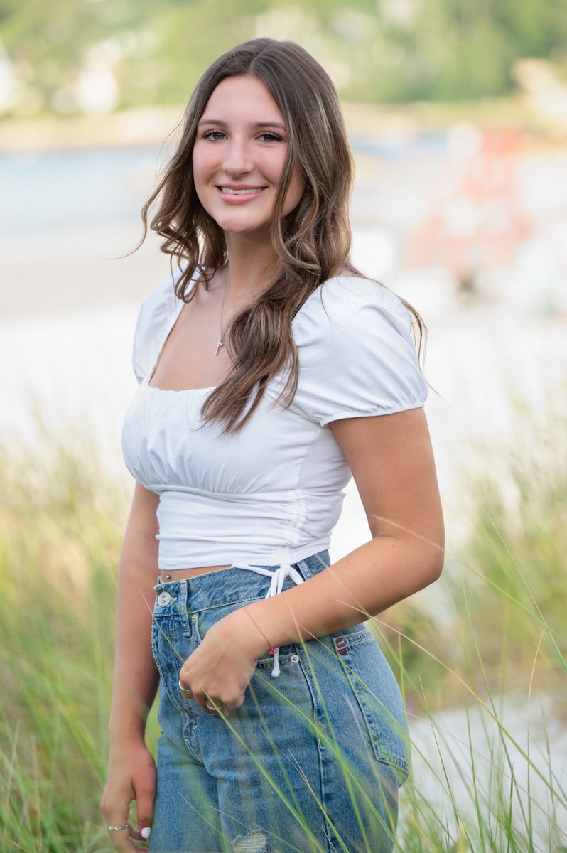 Senior portrait at Wingaerseek beach on tall grass and dunes, gloucester, ma