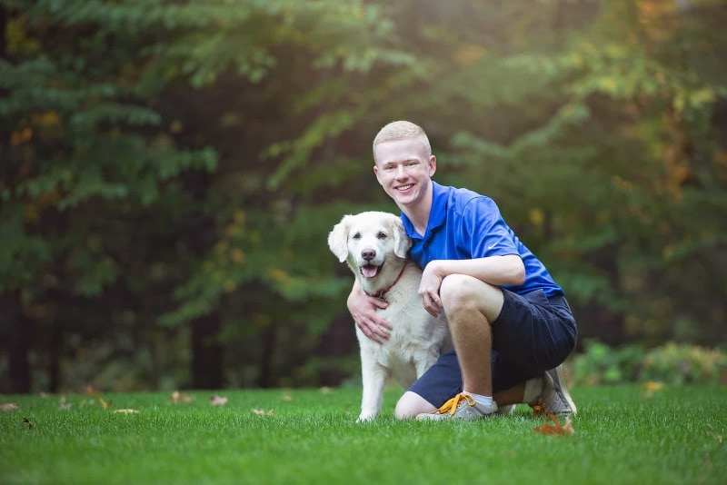 Senior portrait with dog outdoors near Chelmsford, MA