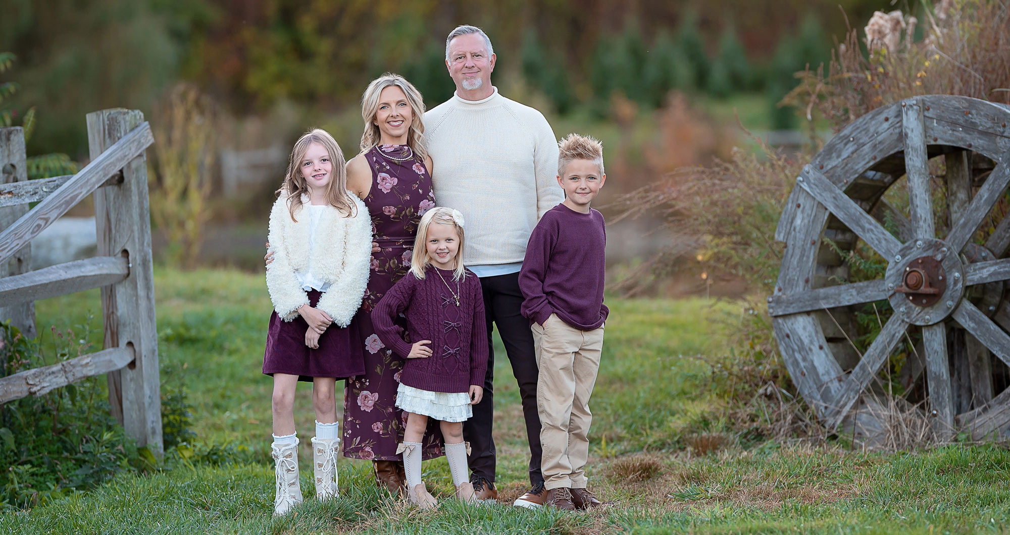 Studio family portrait of parents holding baby in Chelmsford MA