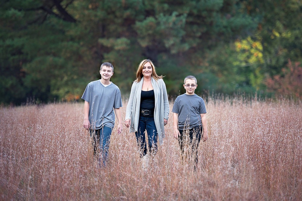 Family under an autumn maple at Francis William Bird Park in Walpole MA