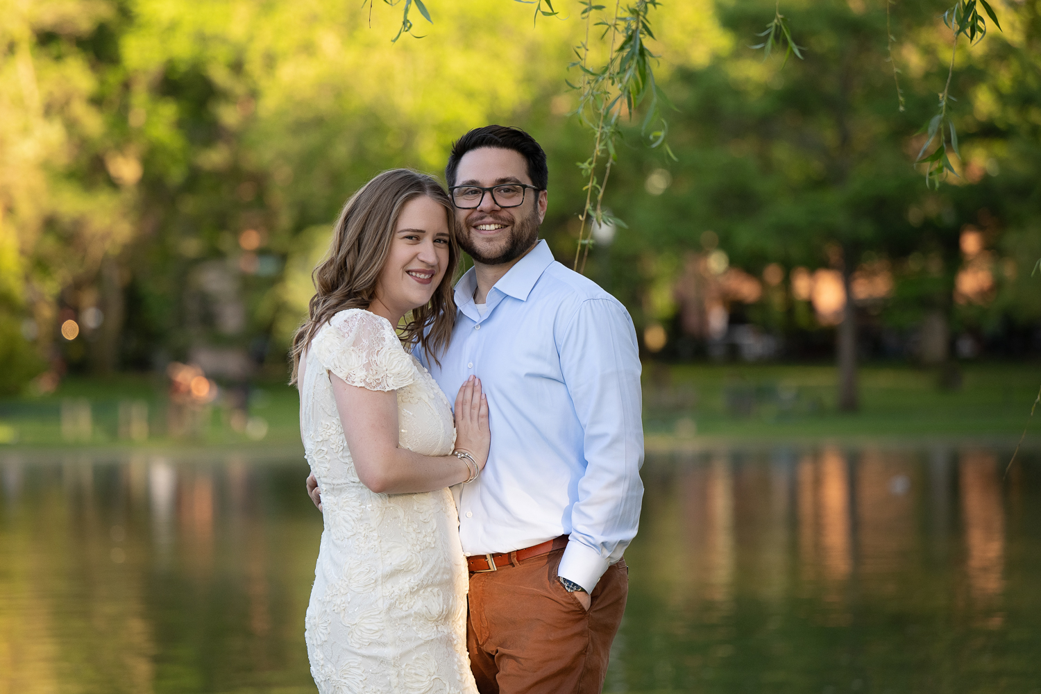 Couple photographed beside the lagoon in the Boston Public Garden in Boston MA